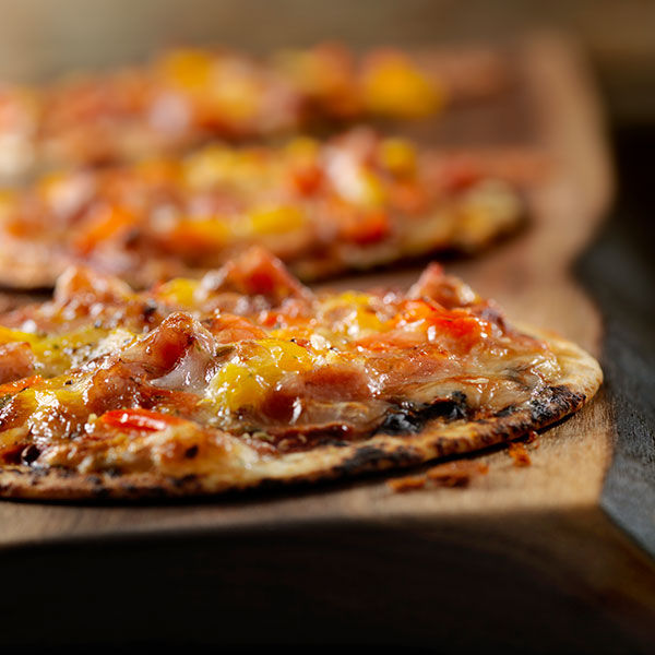 Onion and Pepper Tortilla Pizzas